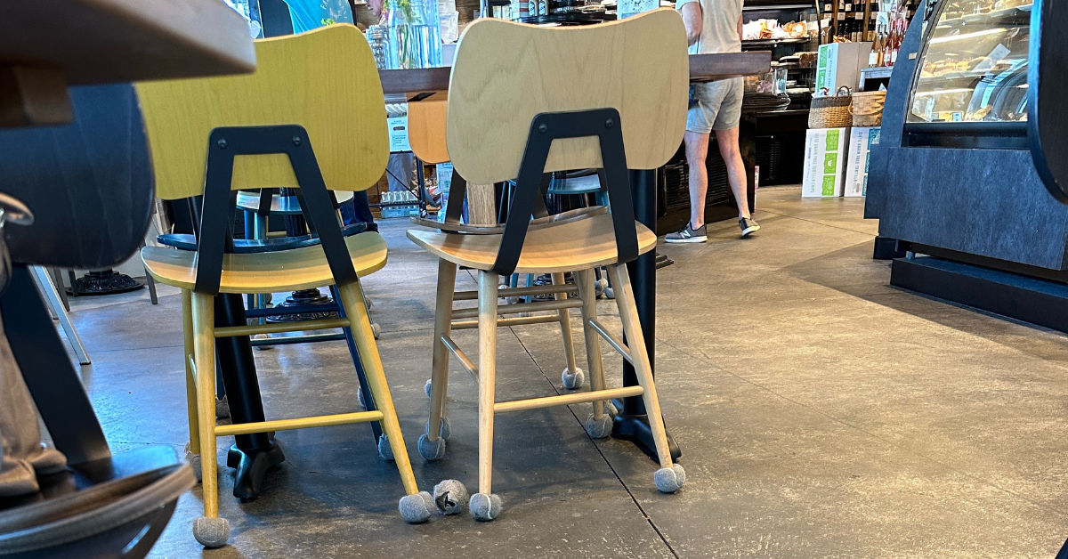 Tennis Balls placed on chair feet in a cafe to improve the customer and employee experience